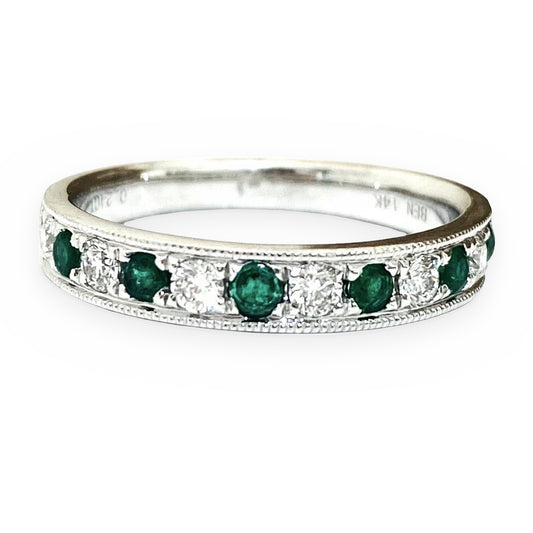 White gold band with alternating round emeralds and diamonds and milgrain edges
