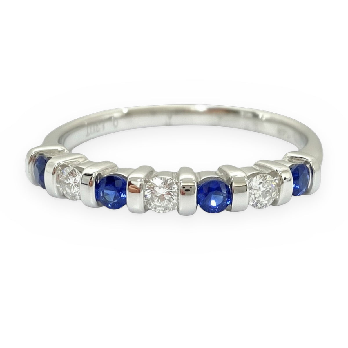 White gold band with bar-set round blue sapphires and round diamonds