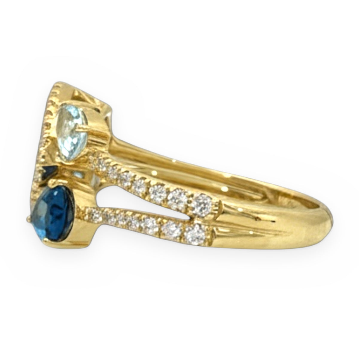 Yellow gold blue topaz bypass ring shown in side profile with split pave shank