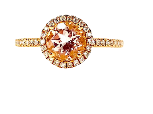 Rose gold ring with a round morganite in a diamond halo on a pave band