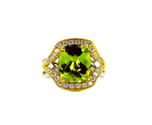 Two-tone gold cushion peridot ring with diamond halo