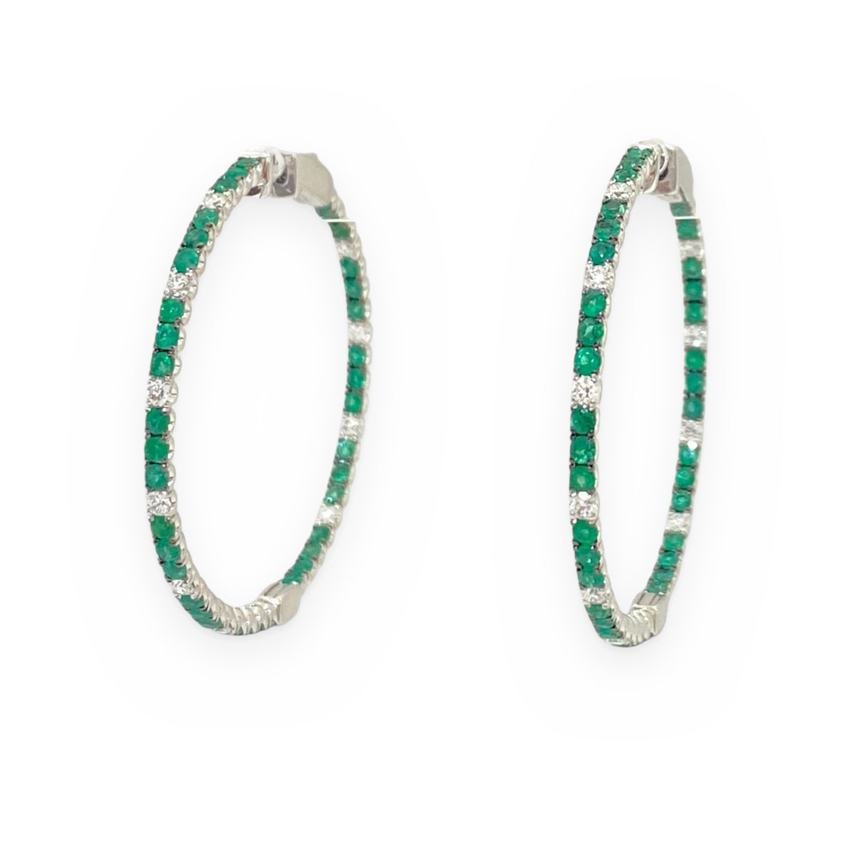 White gold large hoop earrings with alternating emerald and diamond stones