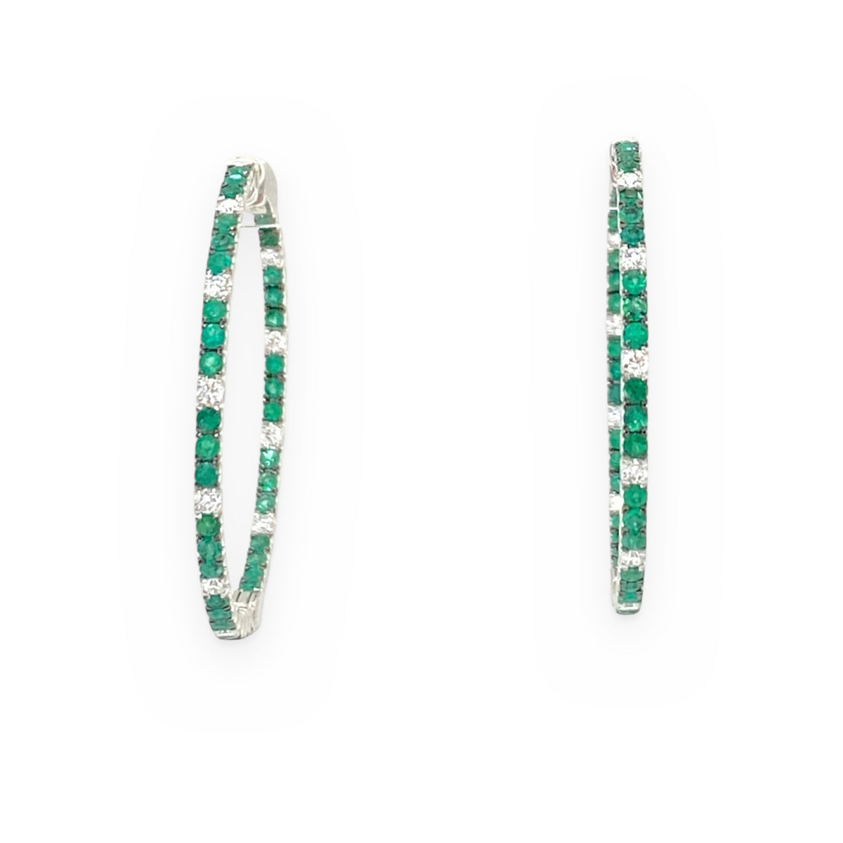 White gold emerald and diamond large hoop earrings, edge-on view