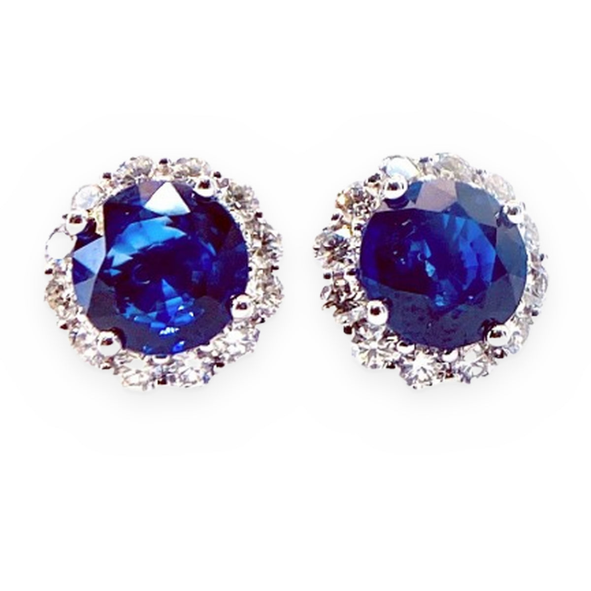White gold round blue sapphire stud earrings with diamond halos