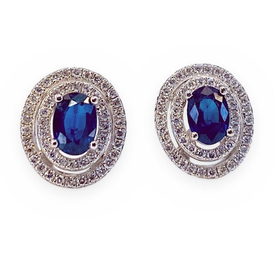 White gold oval blue sapphire stud earrings with double diamond halos