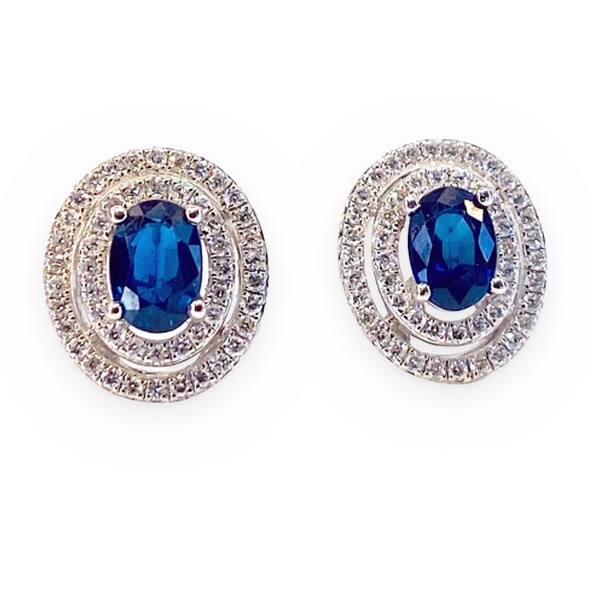 White gold oval sapphire double-halo stud earrings, front view