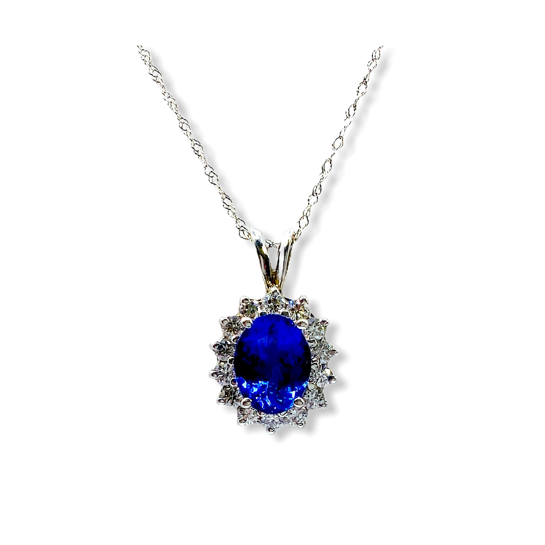 White gold oval tanzanite pendant necklace with diamond sunburst halo