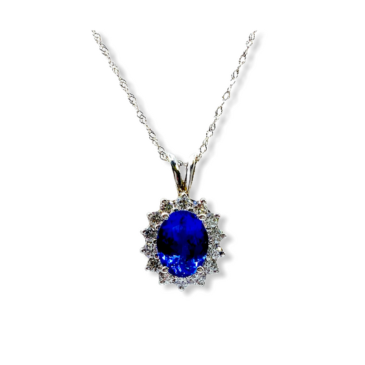 White gold oval tanzanite pendant necklace with diamond sunburst halo