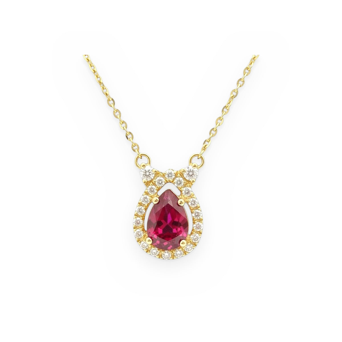 Yellow gold pear-shaped ruby pendant with a diamond halo on a cable chain