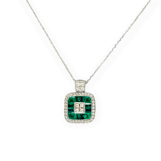 White gold cushion pendant of invisibly-set emeralds around a diamond center with a diamond halo