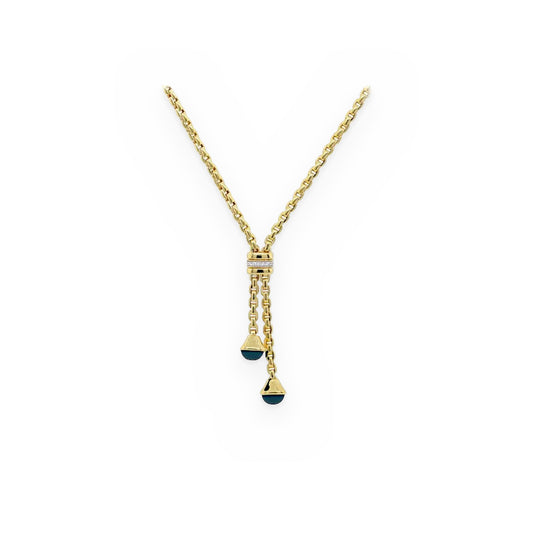 Yellow gold cable-link lariat necklace with a diamond bar and two blue cabochon cone drops