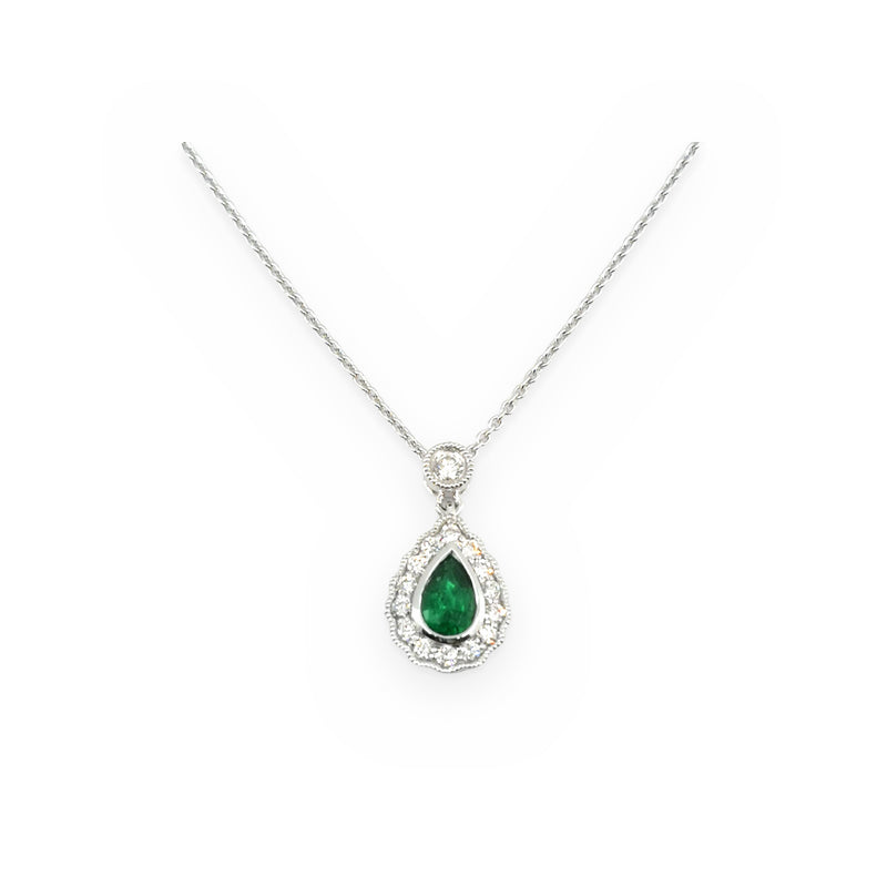 White gold pear-shaped emerald drop pendant with a milgrain diamond halo and bezel-set diamond