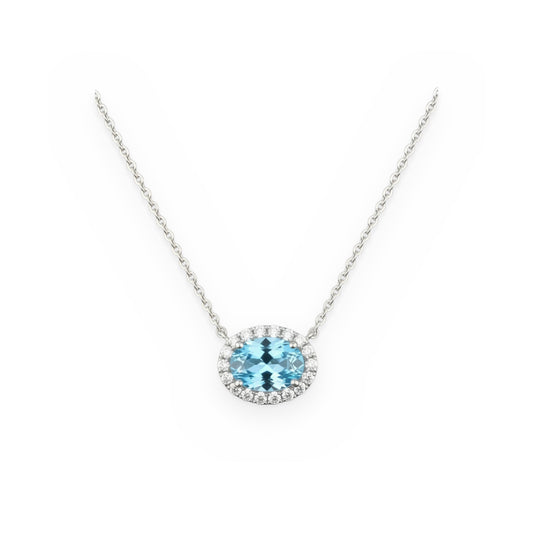 White gold oval aquamarine pendant with a diamond halo on a cable chain
