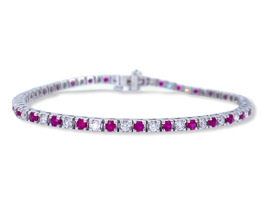 White gold tennis bracelet alternating round rubies and round diamonds