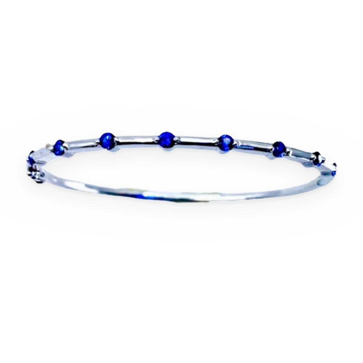 White gold thin bangle bracelet station-set with round blue sapphires