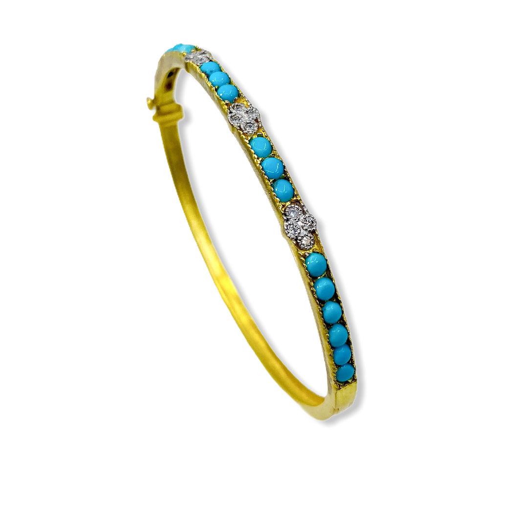 Yellow gold turquoise and diamond quatrefoil bangle shown at a three-quarter angle