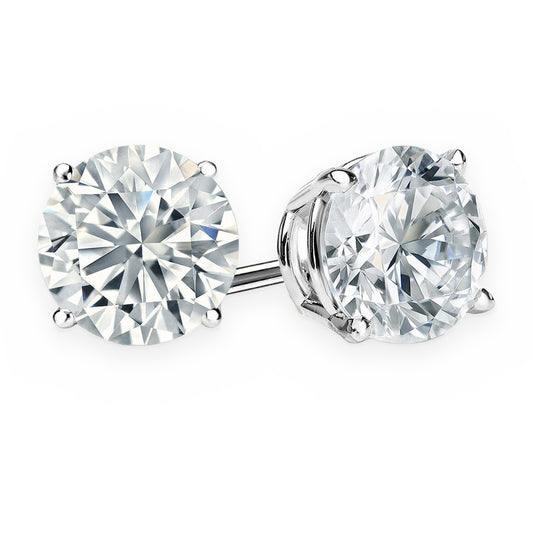 Pair of round brilliant diamond stud earrings in white gold four-prong settings
