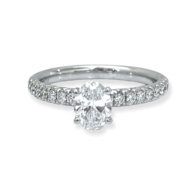 White gold oval diamond solitaire engagement ring with pave band