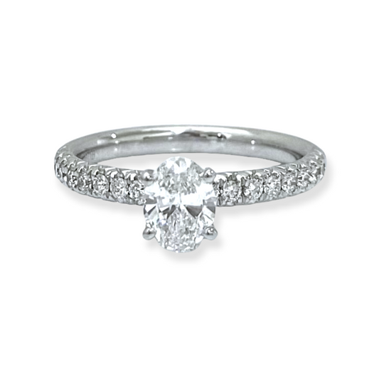 White gold oval diamond solitaire engagement ring with pave band