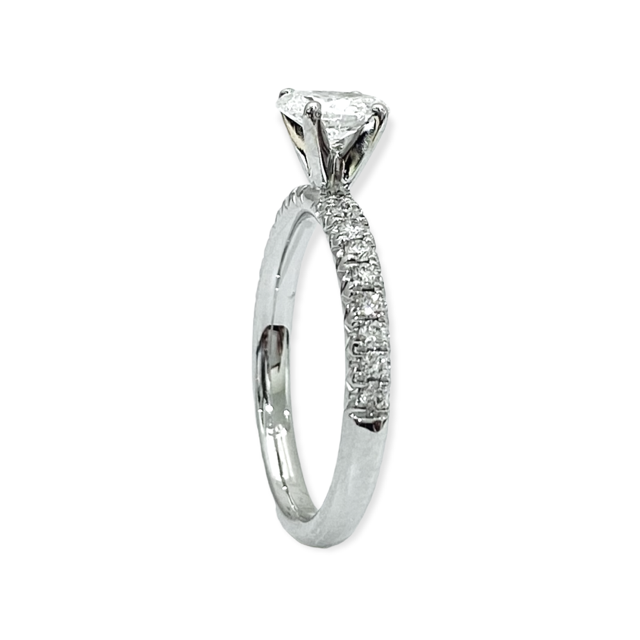 Side view of a white gold oval diamond solitaire with pave band
