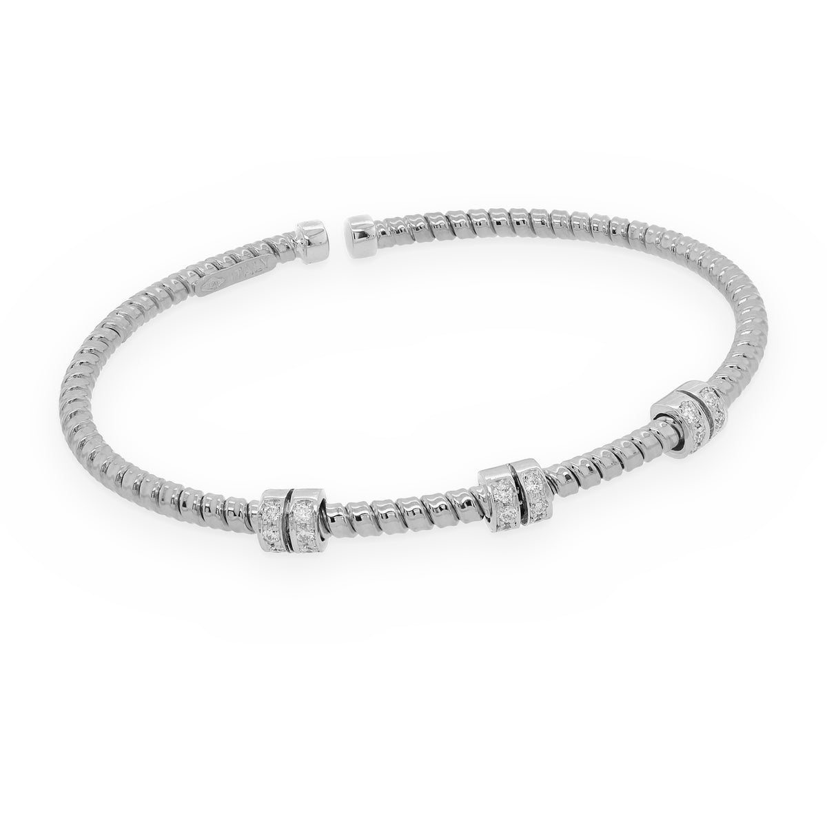 18K white gold ribbed flexible cuff bracelet with three diamond-set stations
