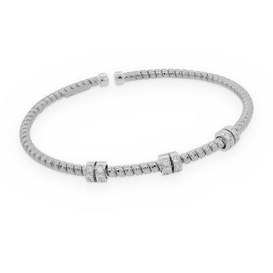 18K white gold ribbed flexible cuff bracelet with three diamond-set stations