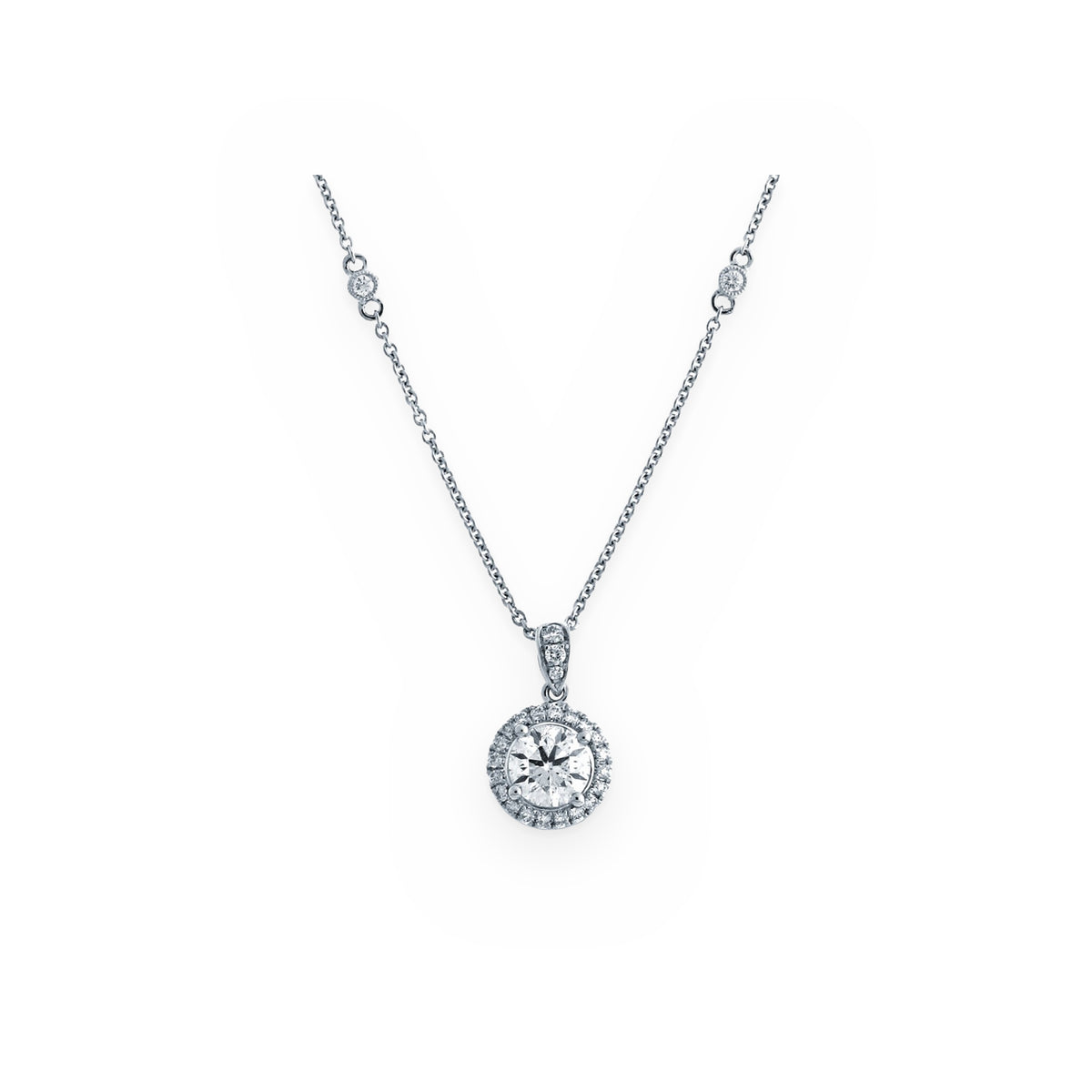 White gold round diamond halo pendant on a diamond-station chain