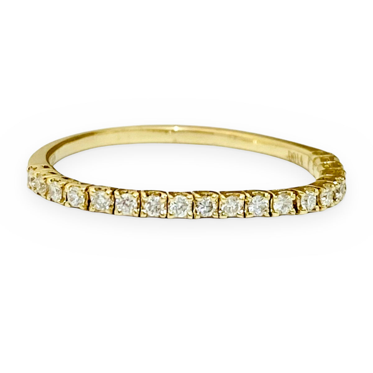 Yellow gold flexible diamond eternity band, angled view