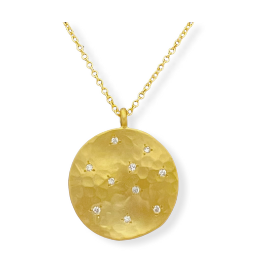Hammered yellow gold round disc pendant with scattered star-set diamonds on a gold chain