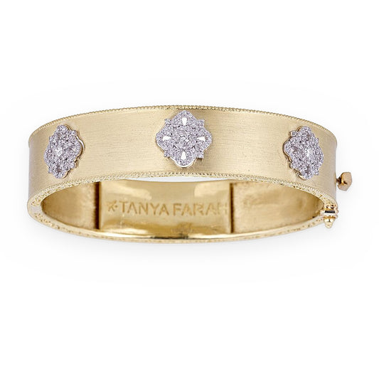 Tanya Farah yellow gold hinged bangle with three diamond pave clover stations